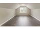 Bedroom featuring a sloped ceiling and wood floors at 4248 Wellington Hills Ln, Snellville, GA 30039