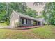 View of home showing siding, driveway, and lush green lawn at 4248 Wellington Hills Ln, Snellville, GA 30039