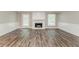 Living room with fireplace, white trim, and gray paint at 4248 Wellington Hills Ln, Snellville, GA 30039