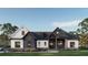 Charming two-story home featuring a symmetrical facade and inviting entrance with landscaped yard at 1779 Granade Sw Rd, Conyers, GA 30094
