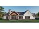 Bright rear exterior featuring a covered patio with a gable, perfect for outdoor gatherings in a serene setting at 1779 Granade Sw Rd, Conyers, GA 30094