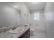 This bathroom features a single sink, granite countertops, tile flooring, and a shower and tub combo at 220 Harwell Nw Rd, Atlanta, GA 30331
