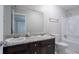 Bathroom features dual sinks, granite counters and a tub with shower at 220 Harwell Nw Rd, Atlanta, GA 30331