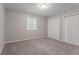 Bright bedroom featuring neutral walls, a window and double closets at 220 Harwell Nw Rd, Atlanta, GA 30331