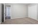 This comfortable bedroom has neutral carpeting, a double closet, and a view into the next room at 220 Harwell Nw Rd, Atlanta, GA 30331