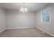 Bright dining room with modern chandelier and large window at 220 Harwell Nw Rd, Atlanta, GA 30331