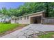 View of the home with an extended driveway and an adjacent carport at 220 Harwell Nw Rd, Atlanta, GA 30331