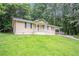 Well-kept single-story home featuring a lush front lawn and inviting entrance at 220 Harwell Nw Rd, Atlanta, GA 30331
