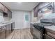 Modern kitchen with stainless steel appliances and updated countertops at 220 Harwell Nw Rd, Atlanta, GA 30331
