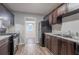 Well-lit kitchen featuring modern appliances and wood-look floors at 220 Harwell Nw Rd, Atlanta, GA 30331