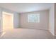 Inviting living room with neutral paint, plush carpet, and natural light at 220 Harwell Nw Rd, Atlanta, GA 30331