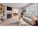 Bright living room with fireplace, plush carpet, and views into the dining room at 220 Harwell Nw Rd, Atlanta, GA 30331