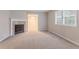 Cozy living room with fireplace and plush carpet at 220 Harwell Nw Rd, Atlanta, GA 30331