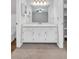 Bathroom with a modern vanity with double doors, a large mirror, and modern lighting at 2786 Olde Gate Ct, Snellville, GA 30078