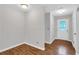 Inviting entryway featuring luxury vinyl floors, neutral paint, and a glass detailed front door at 2786 Olde Gate Ct, Snellville, GA 30078