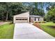Charming single-story home featuring stone accents, an attached garage, and a well-maintained front yard at 2786 Olde Gate Ct, Snellville, GA 30078