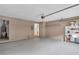 Spacious garage with painted floor, storage shelves, and convenient interior access to the home at 2786 Olde Gate Ct, Snellville, GA 30078