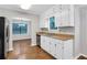 Well-lit kitchen with stainless steel appliances, white cabinetry, and a view into the breakfast area at 2786 Olde Gate Ct, Snellville, GA 30078