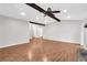 Spacious living room with high ceilings, exposed beam, luxury vinyl flooring, and a fireplace at 2786 Olde Gate Ct, Snellville, GA 30078