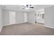 Spacious main bedroom with carpet, a ceiling fan, and a bathroom with ample vanity space at 2786 Olde Gate Ct, Snellville, GA 30078