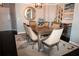 Elegant dining room featuring a modern chandelier, stylish mirror and seating for six at 3475 Oak Valley Ne Rd # 980, Atlanta, GA 30326