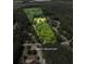 Lot features approximate lines amidst wooded privacy, promising serenity and seclusion in a natural landscape at 4841 Partee Trl, Social Circle, GA 30025