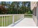 Bright white deck is perfect for outdoor entertaining or relaxing, with views of lush landscaping and open yard at 4841 Partee Trl, Social Circle, GA 30025