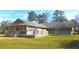 Spacious backyard featuring a screened-in porch, a deck and ample outdoor space at 4841 Partee Trl, Social Circle, GA 30025