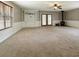 Spacious basement with carpet floors, large windows, and a walkout to the back yard at 4841 Partee Trl, Social Circle, GA 30025