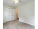 Comfortable bedroom featuring a closet, neutral tones, and carpeted flooring, providing a serene and relaxing environment at 4841 Partee Trl, Social Circle, GA 30025