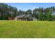 Spacious home with a large yard and a storage shed in the backyard at 4841 Partee Trl, Social Circle, GA 30025
