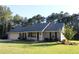 Charming single story home with manicured lawn, attached garage, and inviting front porch at 4841 Partee Trl, Social Circle, GA 30025