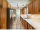 Well-equipped kitchen featuring stainless steel appliances and lots of wood cabinets at 4841 Partee Trl, Social Circle, GA 30025