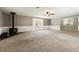 Spacious living room featuring a fireplace and a bay window, providing ample natural light and cozy charm at 4841 Partee Trl, Social Circle, GA 30025