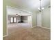 Open-concept living area with wood burning stove, seamlessly connecting to other rooms and offering flexible living space at 4841 Partee Trl, Social Circle, GA 30025