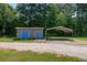 Property with outbuilding and covered carport offering storage solutions and parking, set on a level lot at 4841 Partee Trl, Social Circle, GA 30025