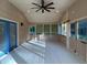 Inviting sunroom with natural light, ceiling fan, screened windows, and access to the backyard at 4841 Partee Trl, Social Circle, GA 30025