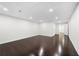 Finished basement area featuring hardwood floors, recessed lighting and neutral colors at 667 Creswell Park, Smyrna, GA 30082