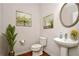 Clean half-bathroom showcases a modern vanity, decor, and stylish mirror at 667 Creswell Park, Smyrna, GA 30082