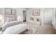 A stylish bedroom featuring soft decor, carpet, and sleek furniture with modern artwork at 667 Creswell Park, Smyrna, GA 30082