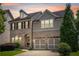 Stunning two-story home featuring a brick facade, gray siding, and a well-manicured lawn at 667 Creswell Park, Smyrna, GA 30082