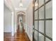 Elegant foyer featuring hardwood floors, decorative molding, and a stylish chandelier at 667 Creswell Park, Smyrna, GA 30082