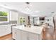 Open kitchen with a large island, connecting to the living room, filled with natural light at 667 Creswell Park, Smyrna, GA 30082