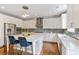 Spacious kitchen with an island, stainless steel appliances, and stylish white cabinetry at 667 Creswell Park, Smyrna, GA 30082