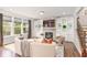 Cozy living room features a stone fireplace and built-in shelving and storage at 667 Creswell Park, Smyrna, GA 30082