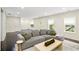 Spacious living room boasts hardwood floors, recessed lighting and large windows, and modern décor at 667 Creswell Park, Smyrna, GA 30082