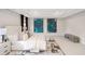 A spacious main bedroom with neutral walls, carpet, tray ceiling and abstract art hanging on the walls at 667 Creswell Park, Smyrna, GA 30082