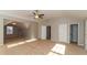 Bright, carpeted bedroom with a connecting lounge area, featuring neutral colors and a ceiling fan at 122 Melrose Creek Dr, Stockbridge, GA 30281