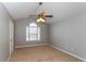 Cozy bedroom with a fan and a large window offering ample natural light at 122 Melrose Creek Dr, Stockbridge, GA 30281