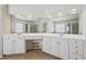 Bright bathroom with double vanity, white cabinets, and a separate bathtub and shower space at 251 Sumac Trl, Woodstock, GA 30188